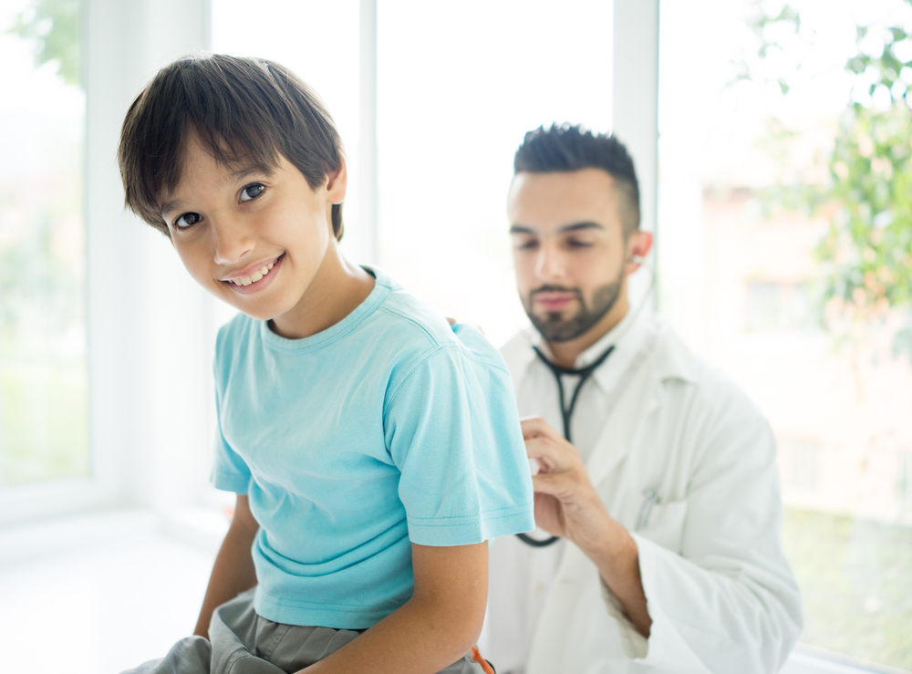 Child at medical checkup with doctor