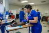 Nursing students practice IV insertion on training arm